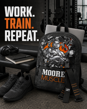 MooreMuscle gym backpack beside a training bench with a laptop, lifting straps, headphones, notebook, and athletic shoes.