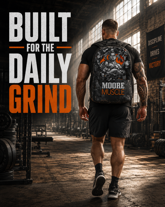 Muscular athlete wearing the MooreMuscle Performance Backpack while walking through an industrial strength-training gym.