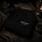 Burn The Ships heavyweight fleece sweatpants displayed on a vintage nautical chart with lantern light, rope, and maritime exploration gear.