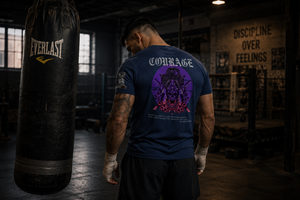 Male athlete wearing the Courage Collection T-shirt inside a powerlifting gym with the samurai skull back graphic fully visible.