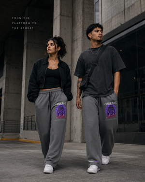 Middle Eastern woman and Latino man styling gray MooreMuscle Courage sweatpants as modern urban streetwear.