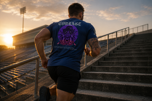 Athlete running stadium stairs in the Courage Collection T-shirt with the large samurai skull graphic visible on the back.
