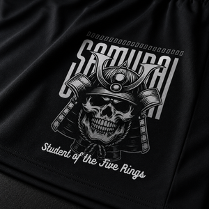 Close-up of the Samurai graphic on MooreMuscle Five Rings training shorts.