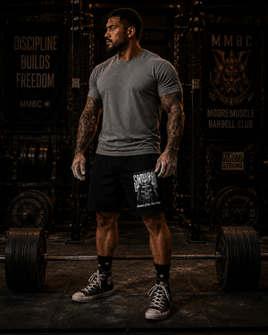 Athlete wearing MooreMuscle Five Rings training shorts with Samurai graphic visible on the front leg.