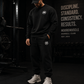Person wearing a black crewneck with a MM logo, standing in front of a gym wall with 'MooreMuscle' branding.