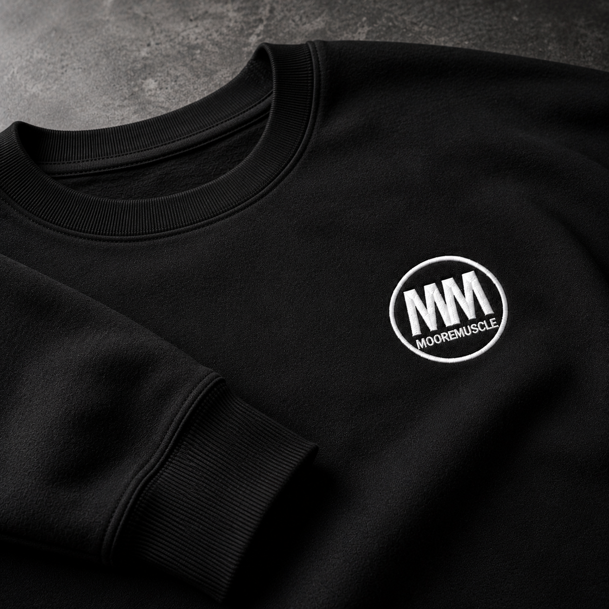 Heavyweight Crew Neck close up detail showing the embroidered MM logo