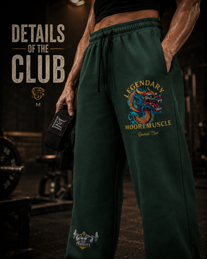 Close-up of green MooreMuscle Legendary sweatpants showing the waistband, drawstring, pocket, and dragon graphic with the text Details of the Club.