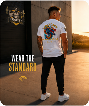 Male athlete styling the white Legendary MooreMuscle Barbell Club T-shirt with black athletic joggers.