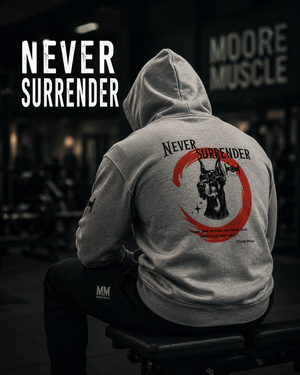 Athlete wearing the Never Surrender zip hoodie in a gym with the Doberman back design.