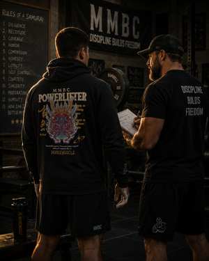 Athlete wearing MooreMuscle MMBC Powerlifter lightweight hoodie inside a powerlifting gym