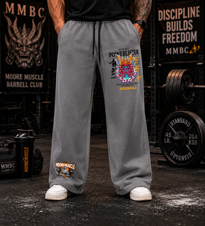 Front view of MooreMuscle Warrior Collection gray wide-leg sweatpants showing graphic placement and relaxed fit.