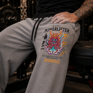 Close-up of Warrior Collection graphic on gray MooreMuscle wide-leg sweatpants.