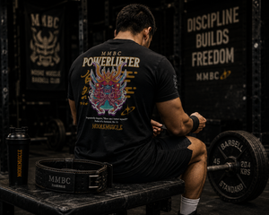 Black Warrior Collection t-shirt worn by seated athlete between training sets