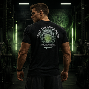 Athlete wearing the Strength and Honor tee with guardian graphic standing inside a powerlifting gym.