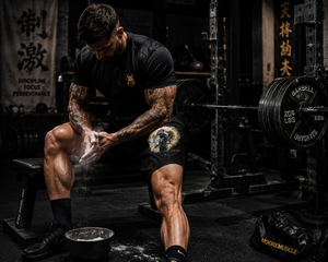Athlete seated in a gym wearing Thousand Mile Performance Shorts during a training session.
