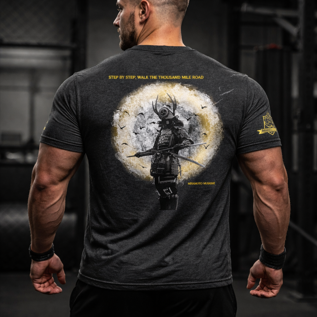 Male athlete wearing a charcoal grey Thousand Mile tee 