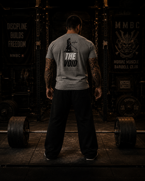 The Void tri-blend tee worn during deadlift setup inside a powerlifting gym.