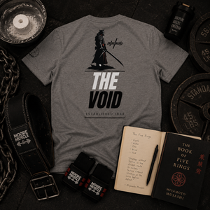 The Void tri-blend tee displayed with training gear and The Book of Five Rings.
