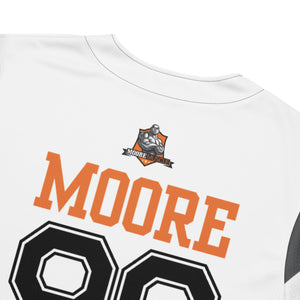 Close-up of chest graphic showing “MOORE” lettering and number detail