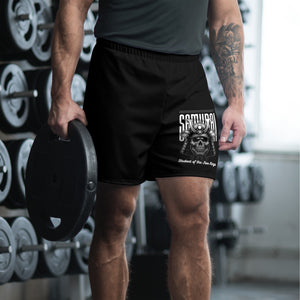 Athlete wearing black Five Rings ‘Void’ shorts walking in gym, side/rear view
