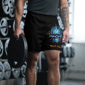 Male athlete wearing black Bench Press shorts showing blue skull graphic during gym workout