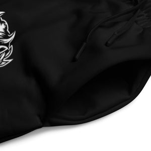 Black sweatpants graphic details with lion illustration and bold yellow SQUAT lettering