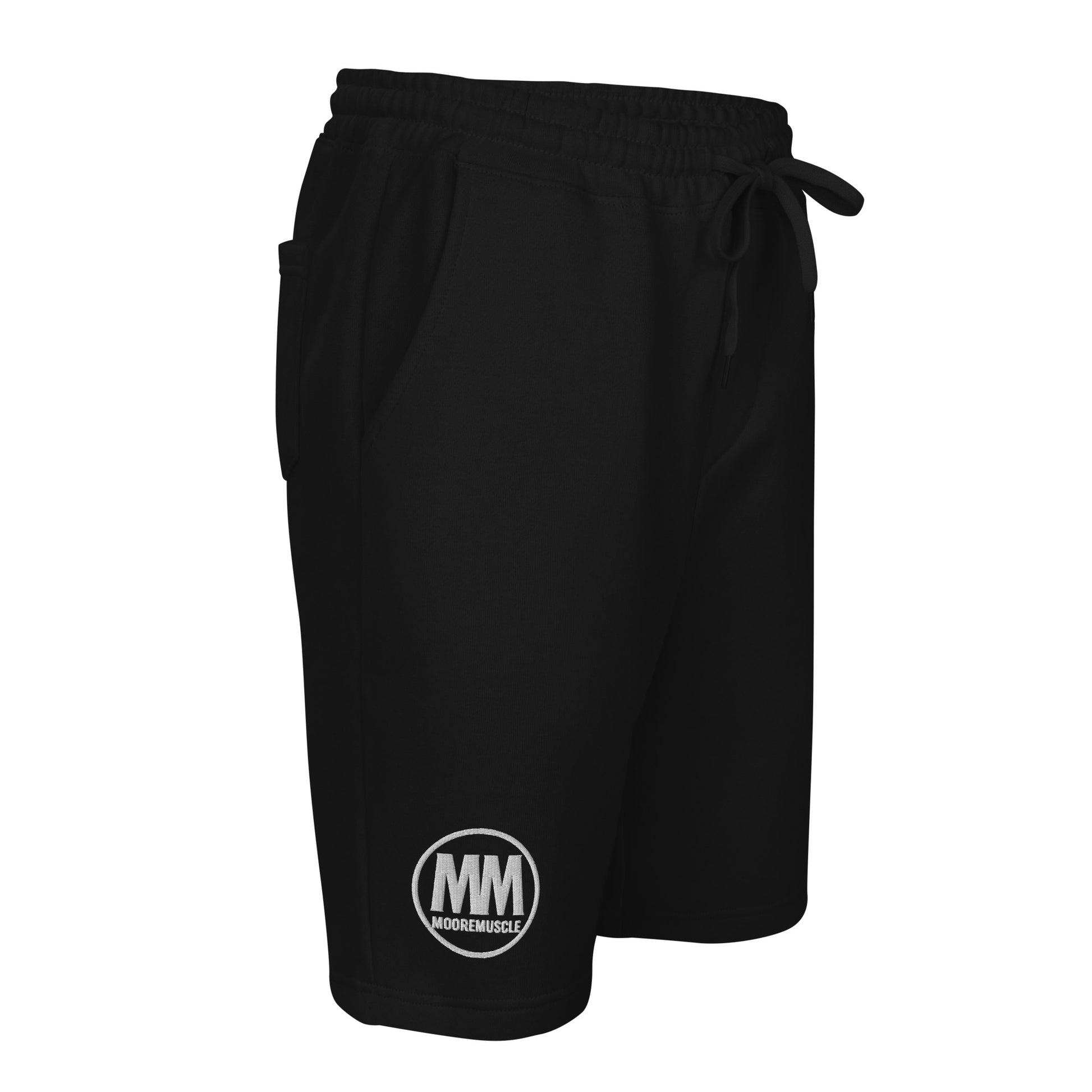 Side view of black MooreMuscle men’s fleece shorts showing tapered leg opening and logo placement