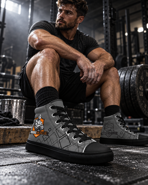Man resting on a plyo box in grey MooreMuscle Crest high top lifting shoes with black soles and geometric pattern