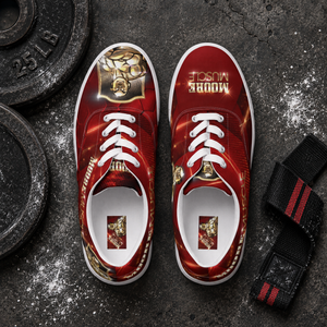 Top-down flat lay of MooreMuscle red low-top training shoes next to weight plates and a lifting strap