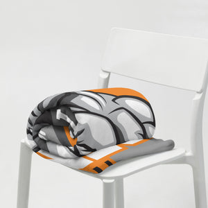 Rolled MooreMuscle throw blanket placed on chair