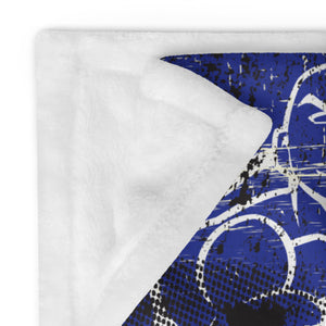 Close-up of MooreMuscle American flag blanket showing soft silk-touch fabric and white reverse side
