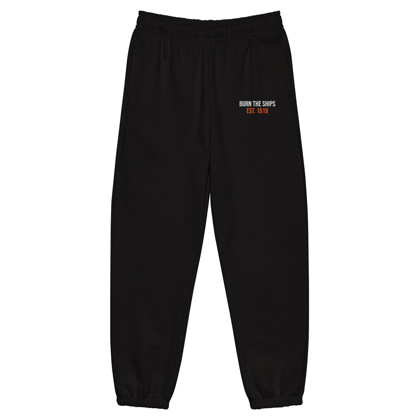 Burn The Ships heavyweight black fleece sweatpants featuring white and orange embroidered Burn The Ships EST. 1519 artwork on the upper thigh.