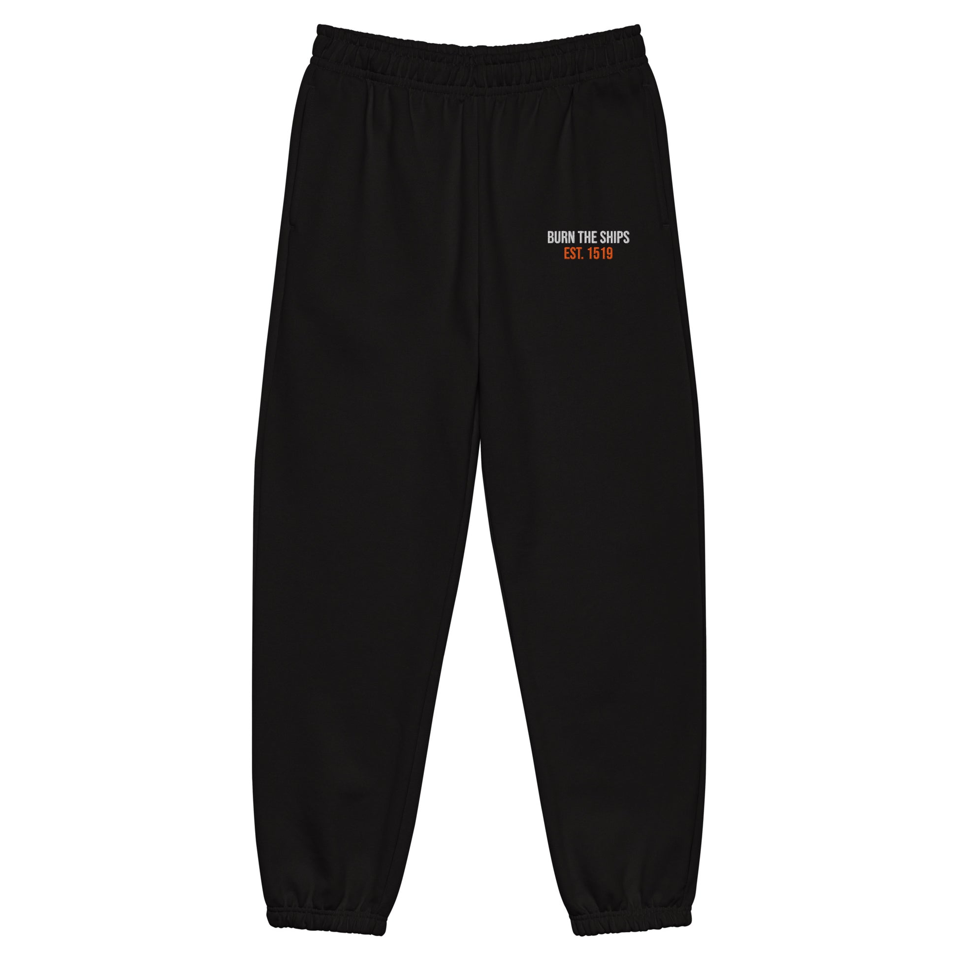 Burn The Ships heavyweight black fleece sweatpants featuring white and orange embroidered Burn The Ships EST. 1519 artwork on the upper thigh.